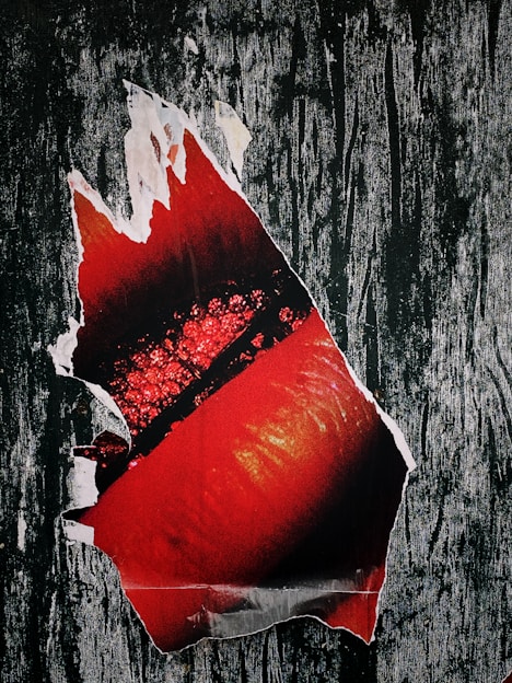 Close-up of a vibrant, hand-printed graphic poster with bold colors and intricate details