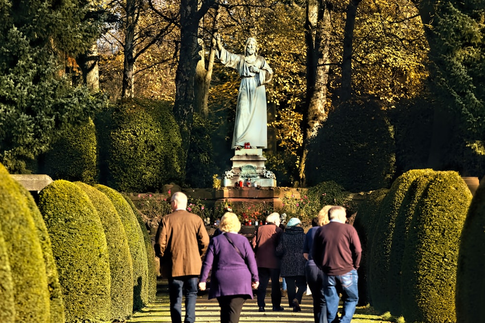 people walking beside mountain