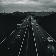 vehicles crossing on road with two lanes