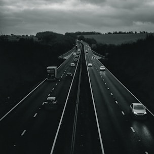 vehicles crossing on road with two lanes