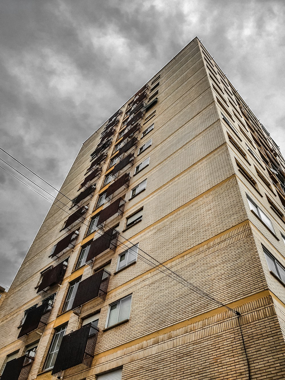 low-angle photograph of gray concrete building