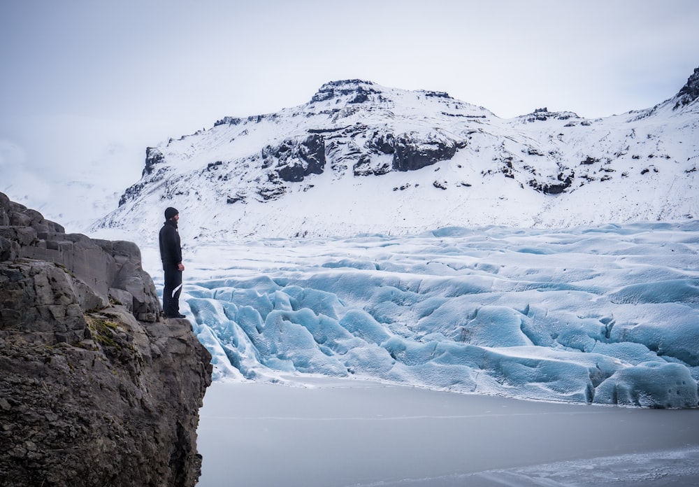 man standing on cliff