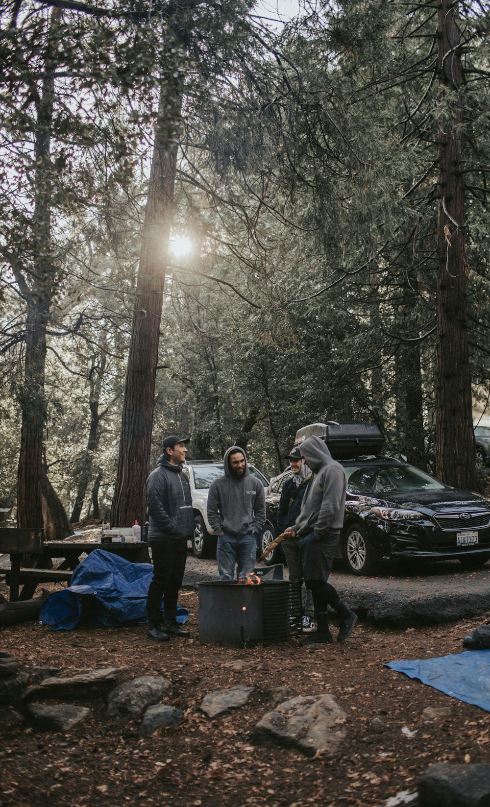 men around fire pit