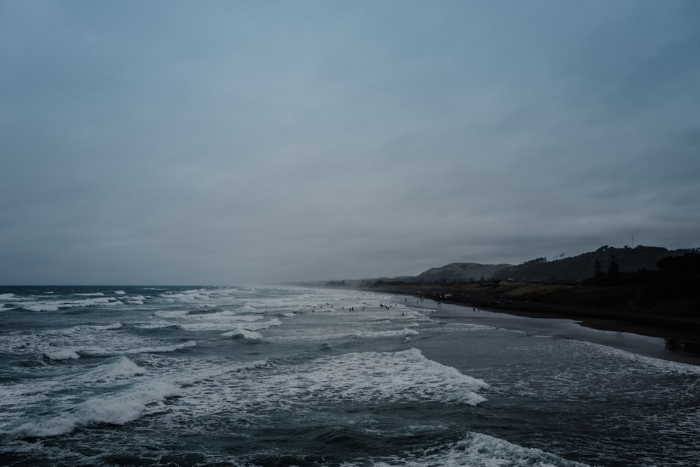 ocean under cloudy sky