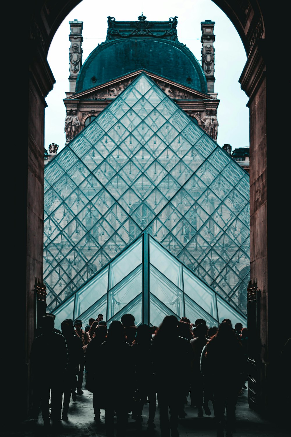 people Louvre Pyramid Paris, France during day