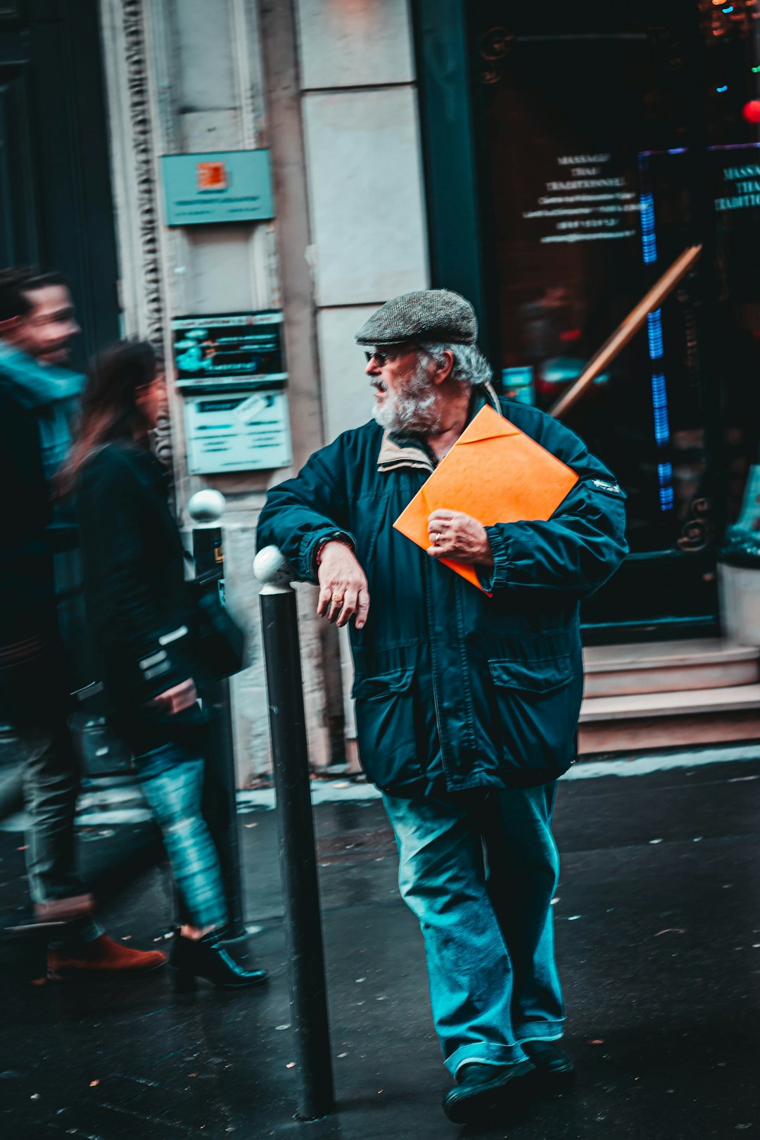 man holding brown envelope