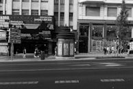 A view of multiple bs express kiosks lined up in a busy urban public space.