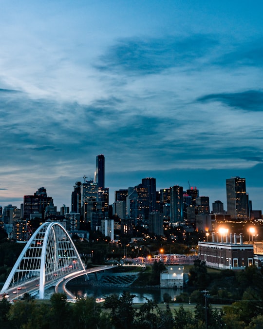 aerial photography of city with high-rise buildings under blue and white sky during night time in Edmonton Canada