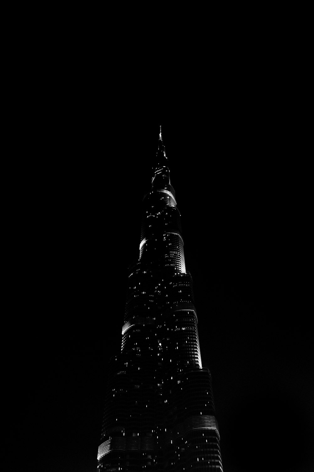 a very tall building lit up at night
