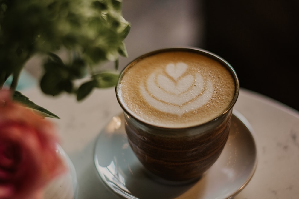 mug filed with coffee on saucer