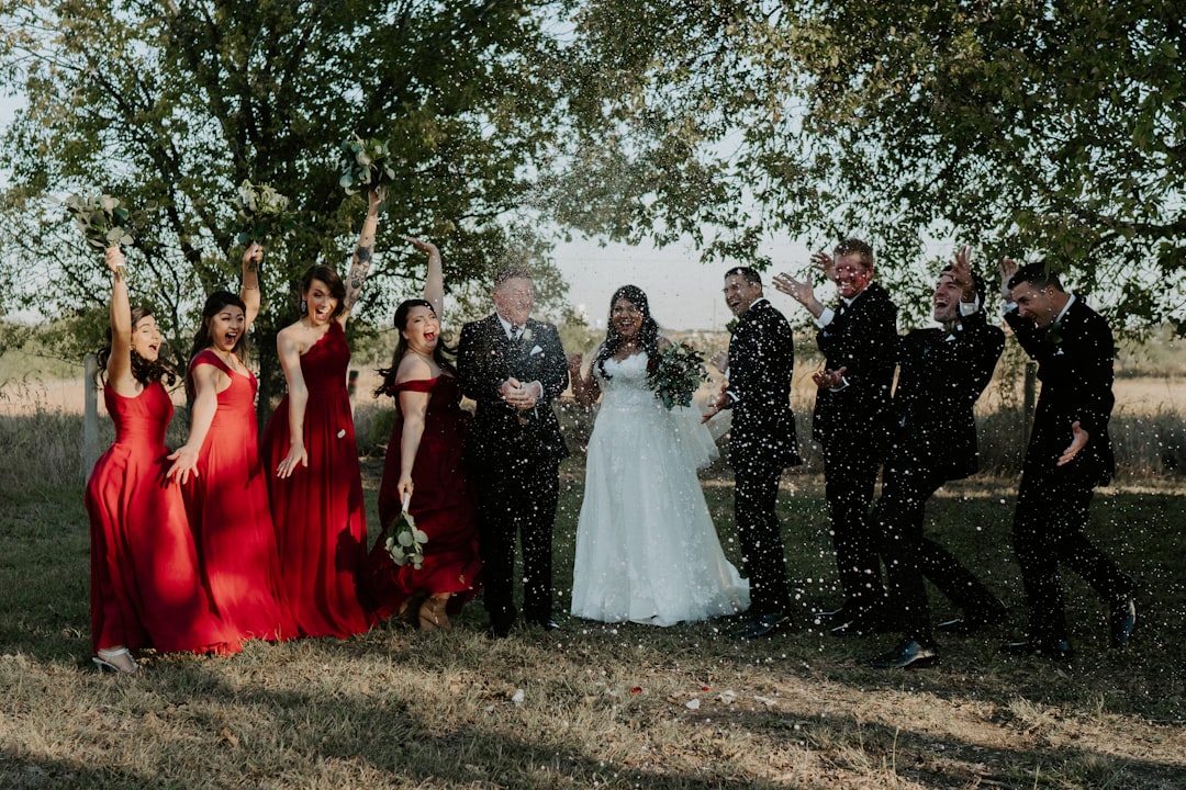wedded couple with grooms men and brides maid