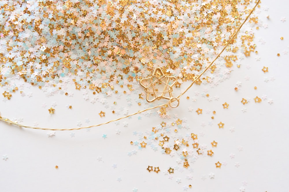 a white table topped with lots of gold stars