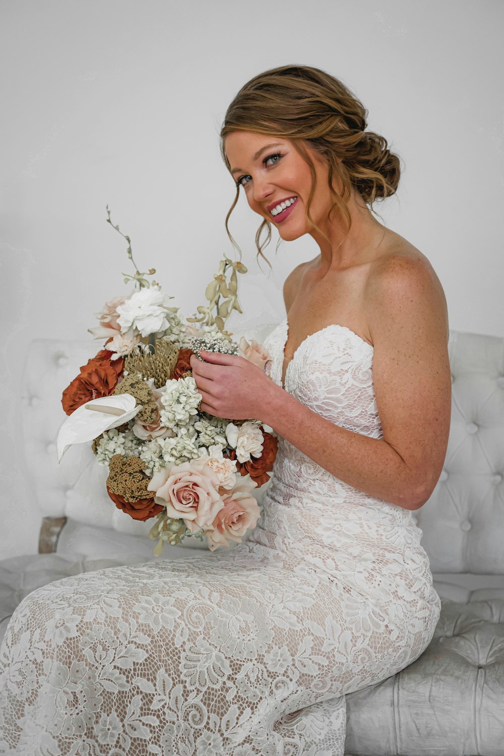 woman holding bouquet of flowers