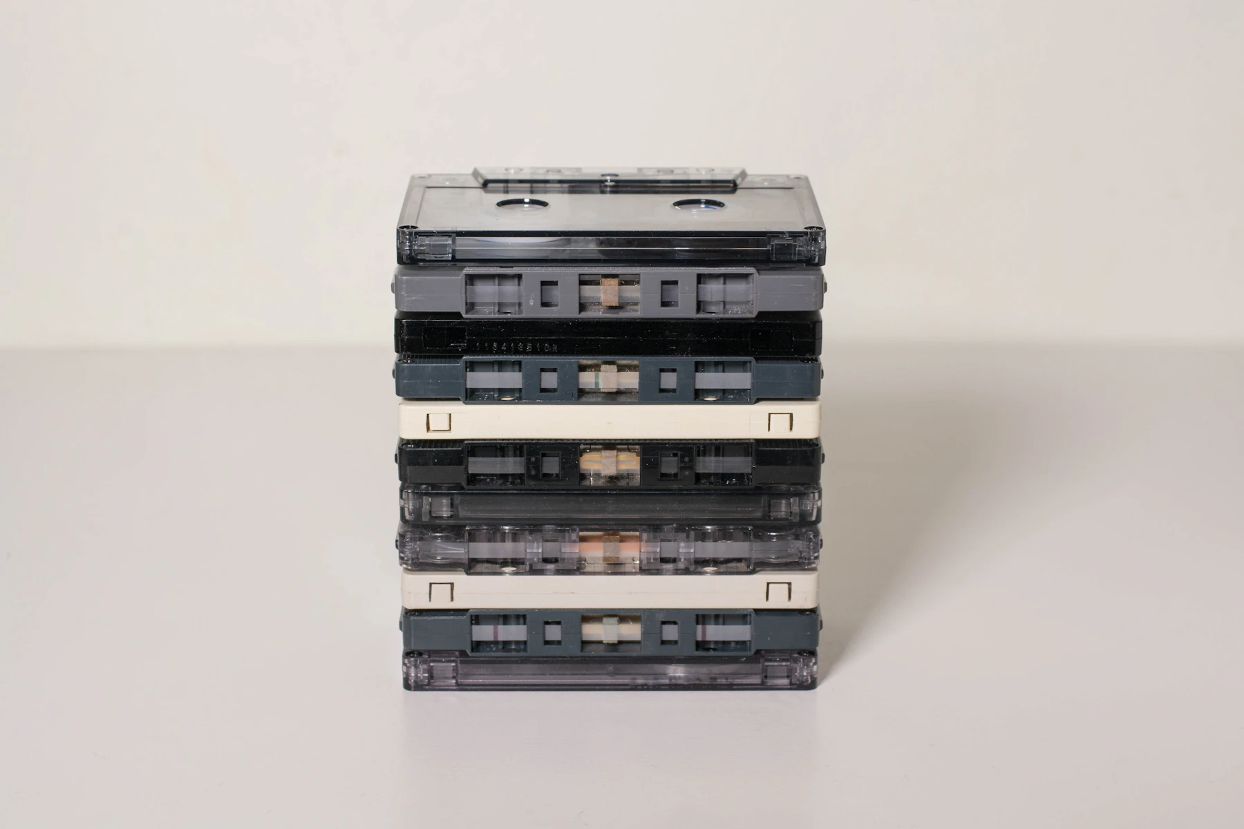 A Vertical Stack Of Vintage Magnetic Cassette Tapes