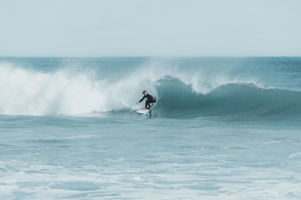 man surfing on waves