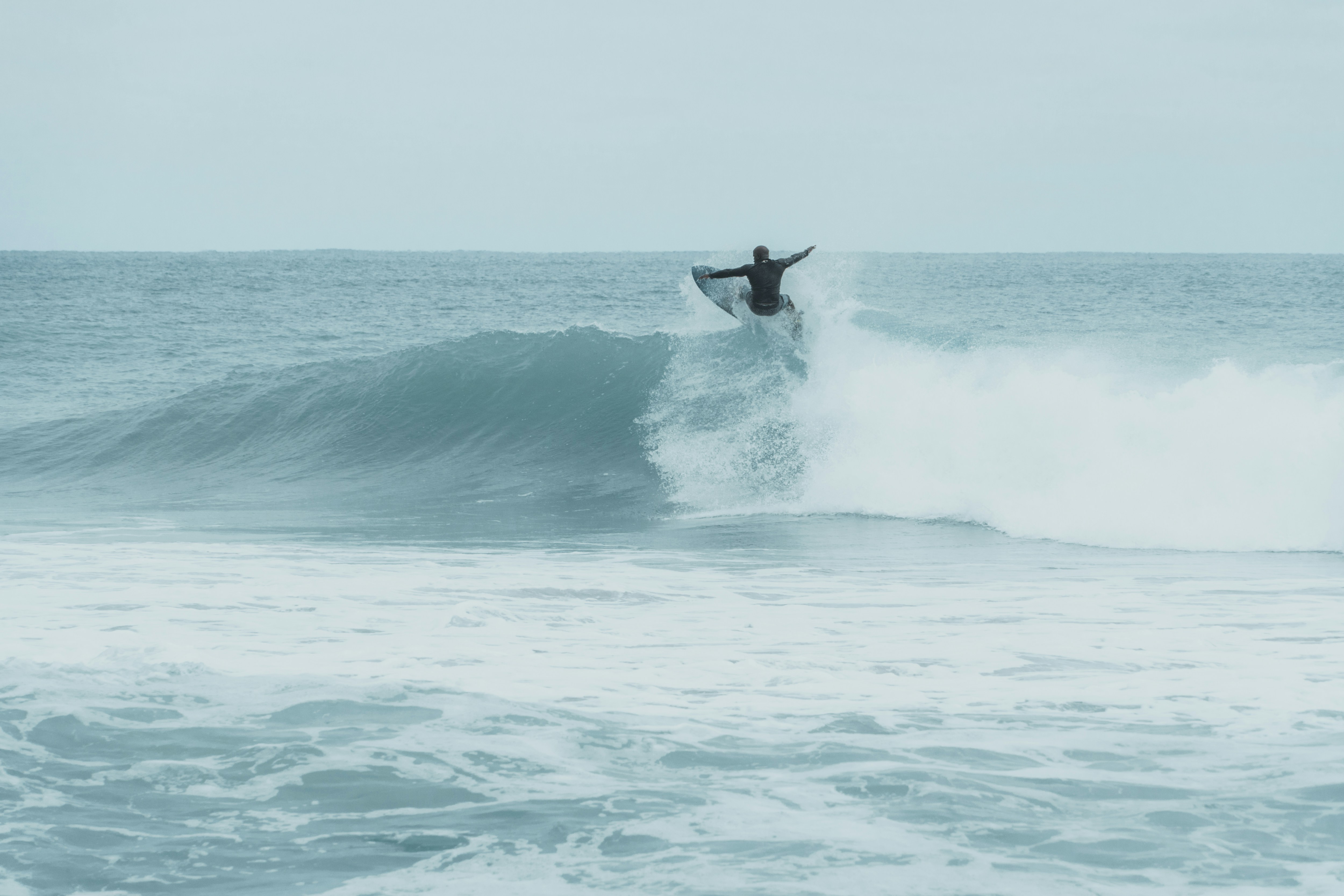 man surfing on waves