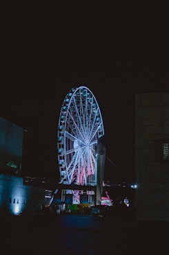 blue lighted ferris wheel during nighttime