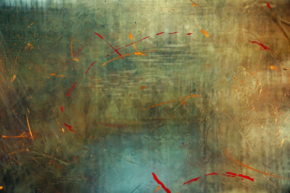 a painting of water and red fish in a pond