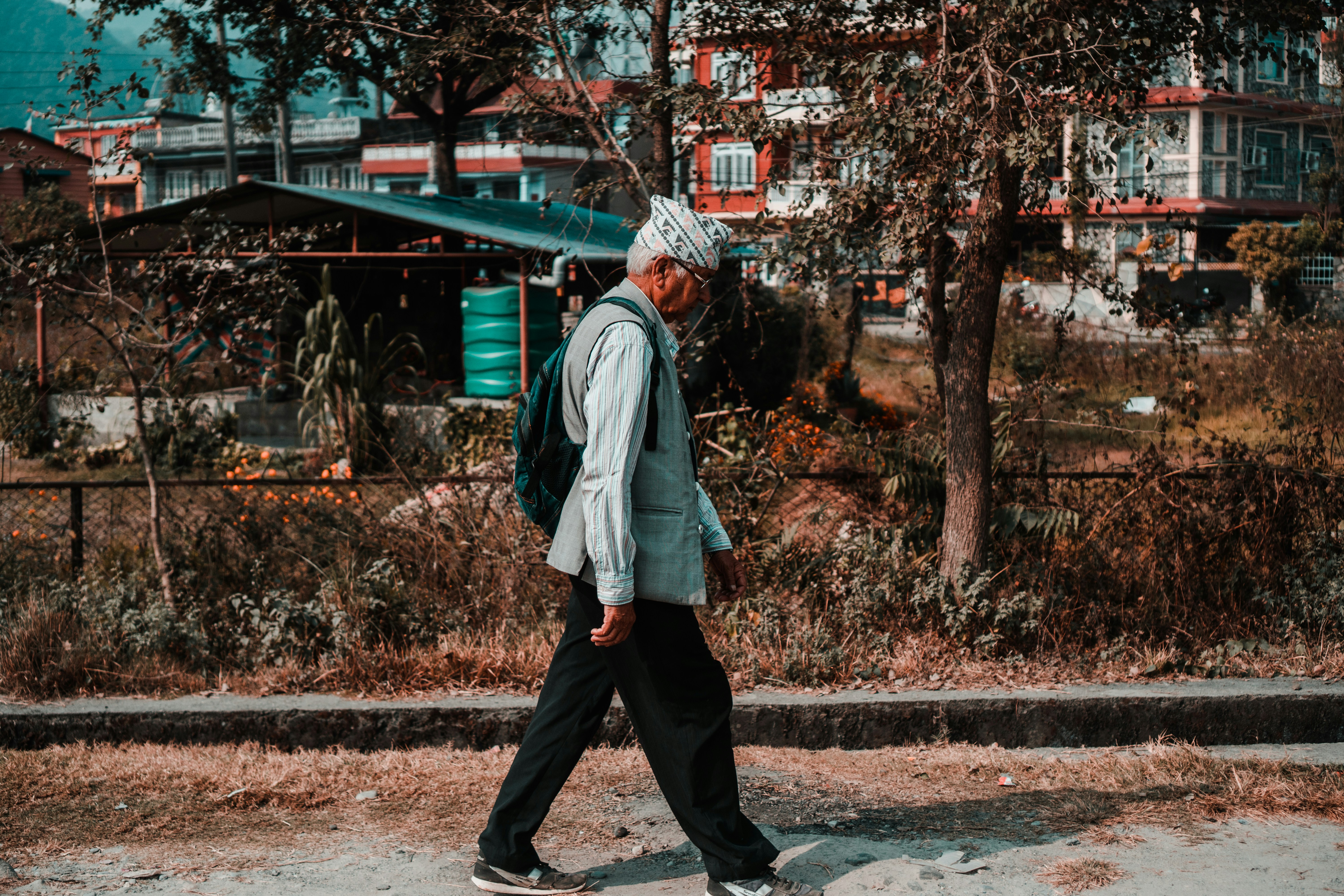 man walking on road