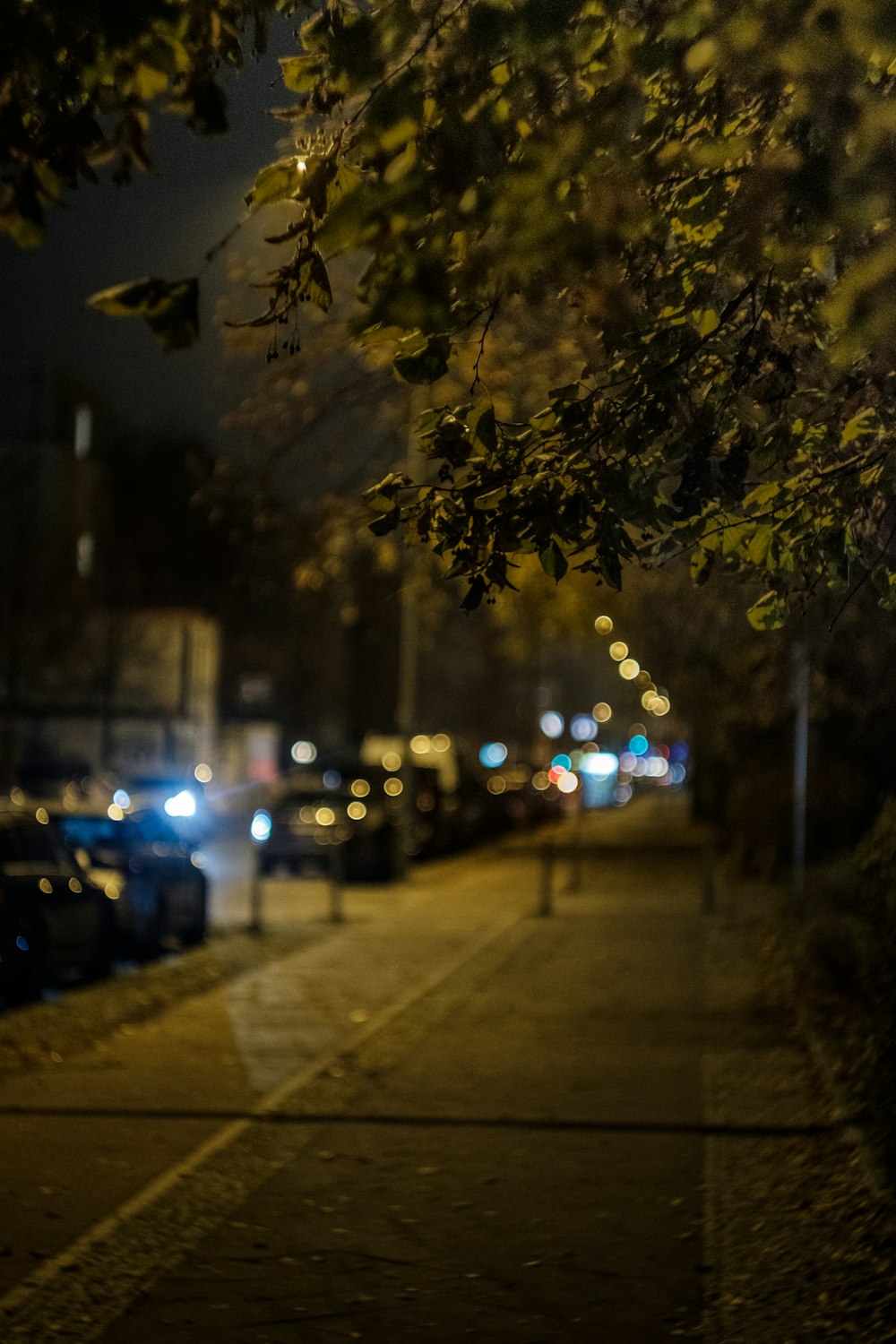 several vehicles parked beside sidewalk