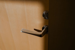 brown wooden door lever