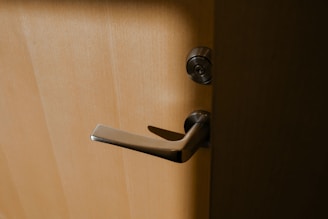 brown wooden door lever