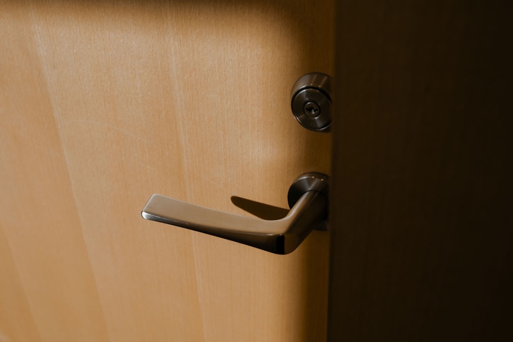 brown wooden door lever