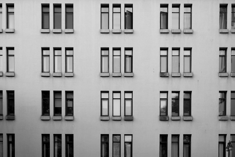 grayscale photography of high-rise building