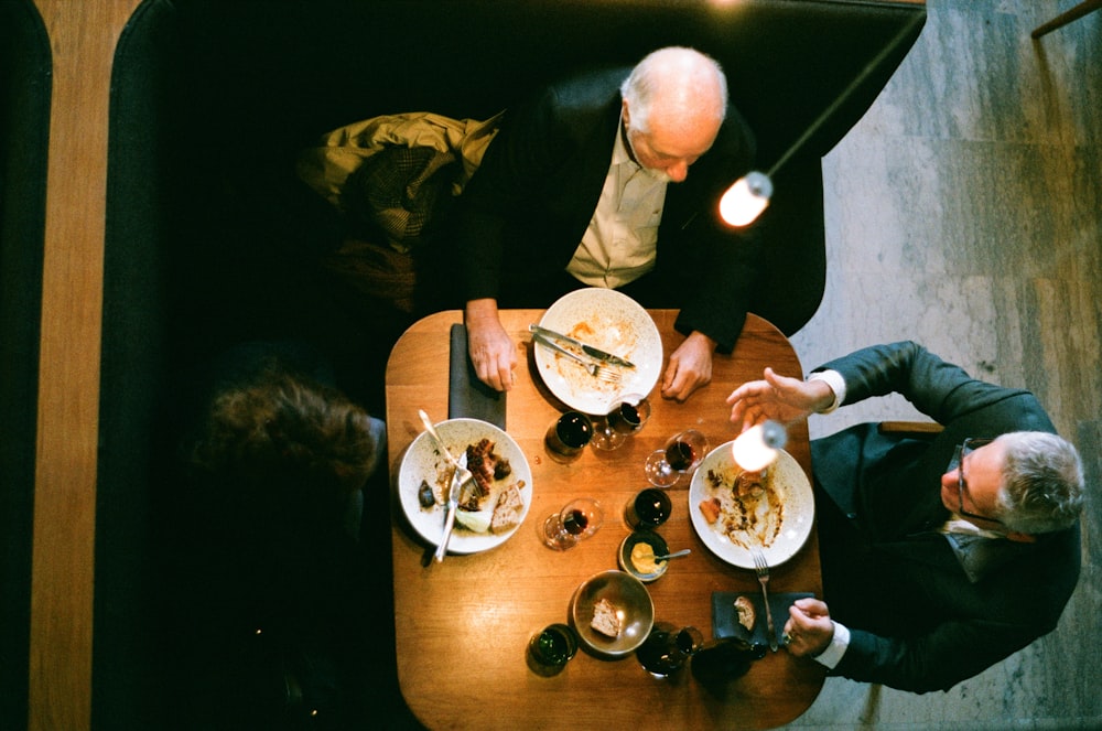 people sitting at the table eating