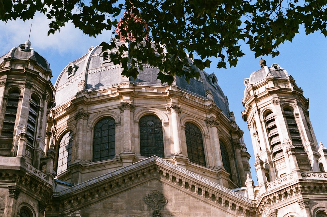 brown and white dome building under blue sky