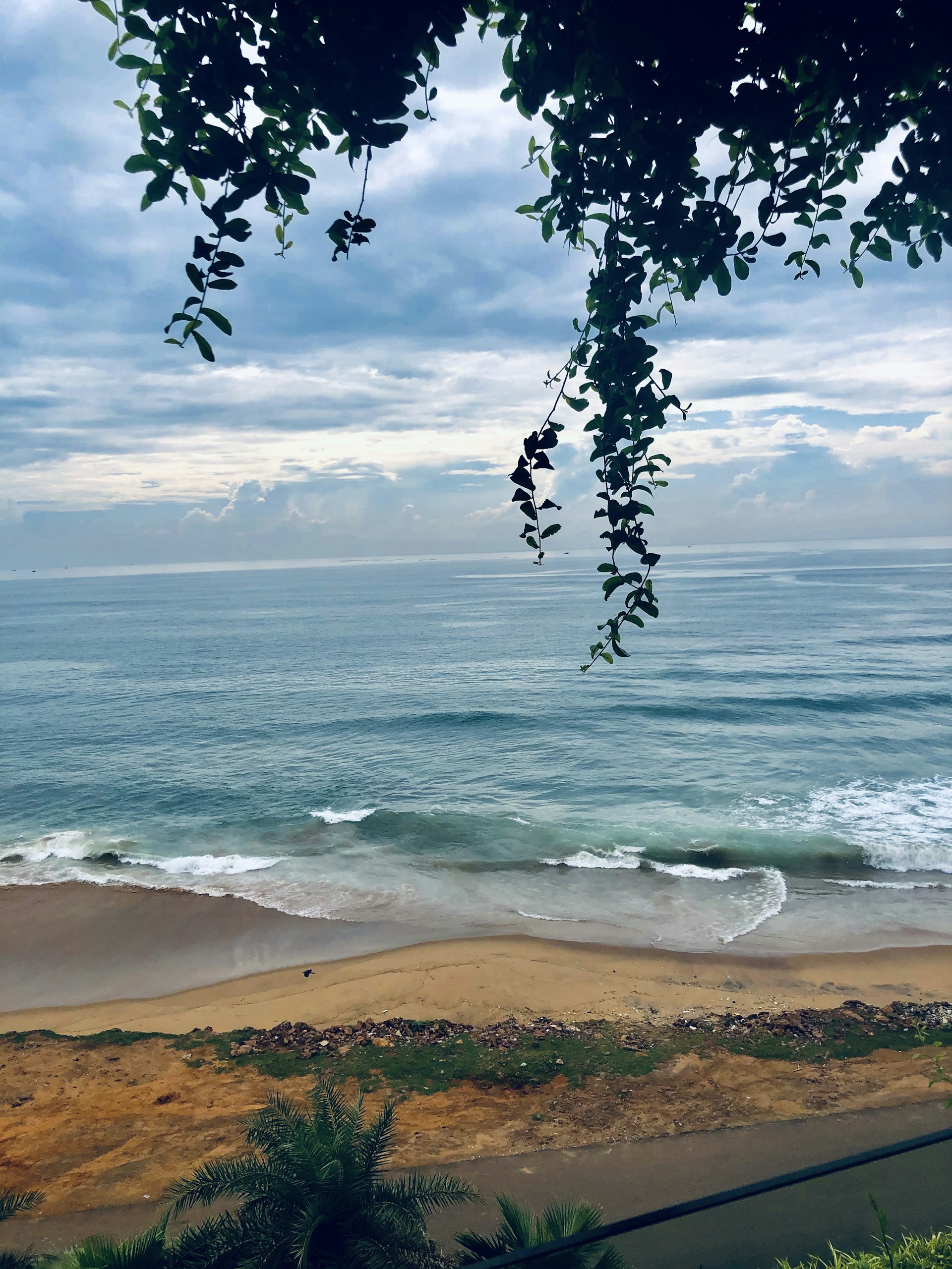 woman wearing yellow long-sleeved dress under white clouds and blue sky during daytime