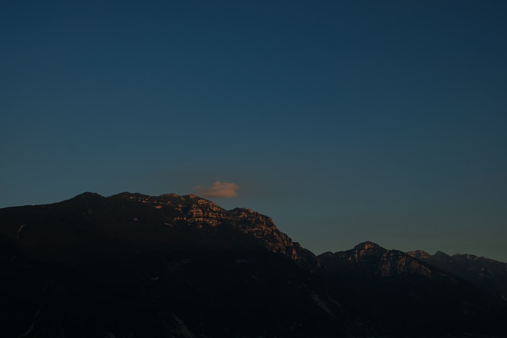 brown and green mountain under blue sky