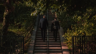 shallow focus photo of person walk up stairs during daytime