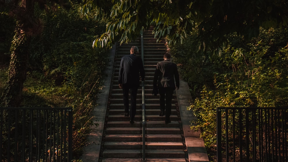 shallow focus photo of person walk up stairs during daytime