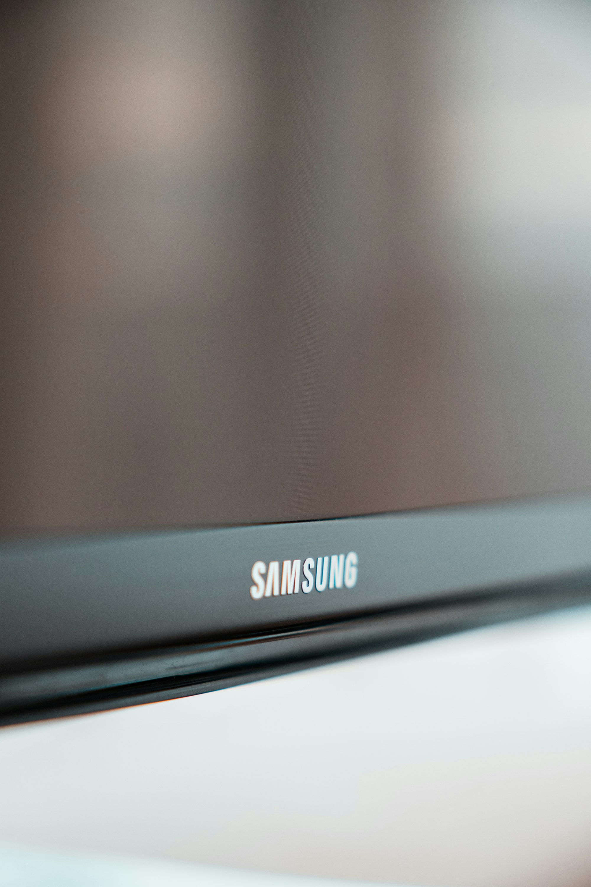shallow focus photo of black Samsung flat screen TV