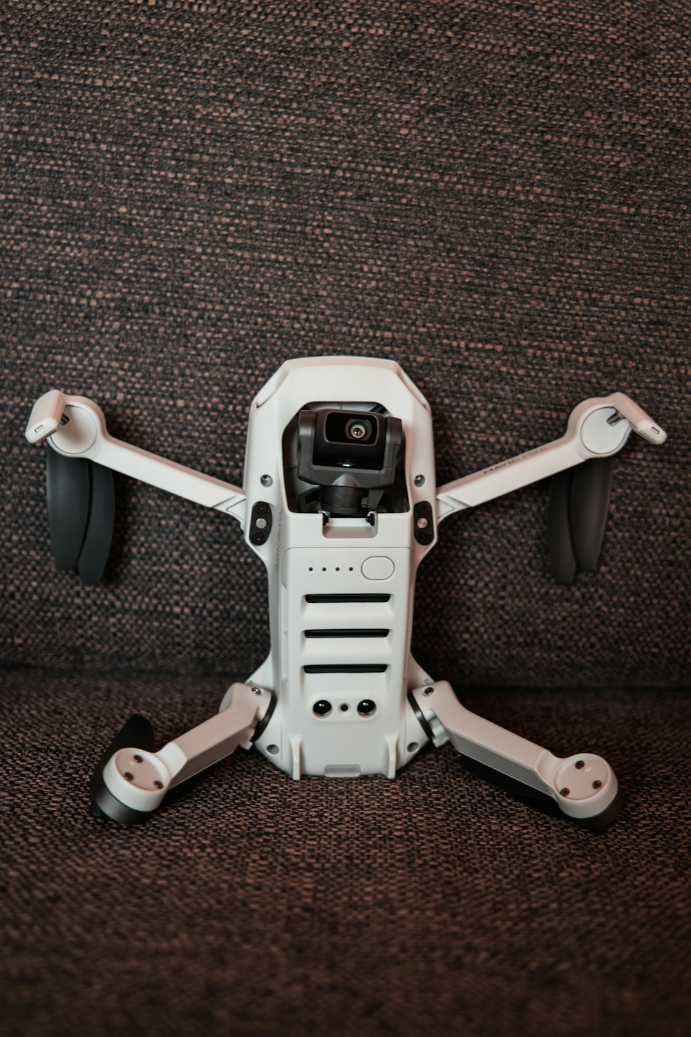 white and black quadcopter drone