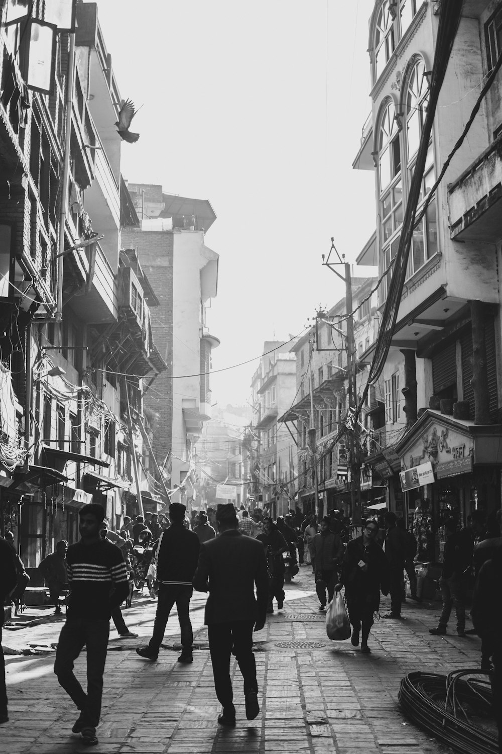 grayscale photo of people in street