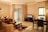 A clean and inviting living room with fresh linens and well-arranged furniture.