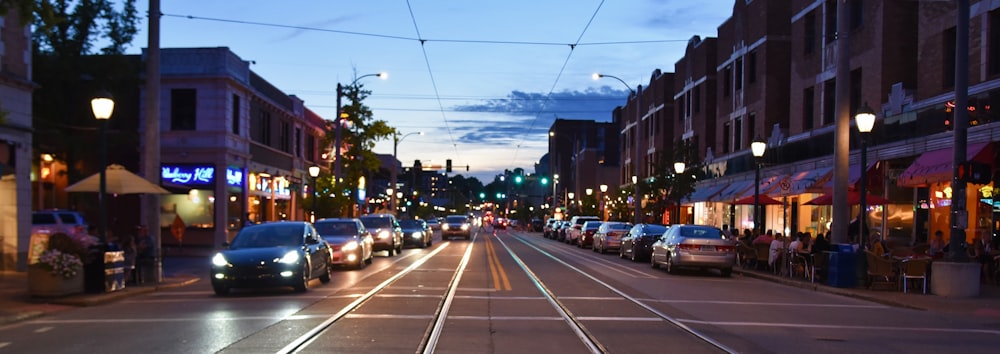 vehicles on road near buildings