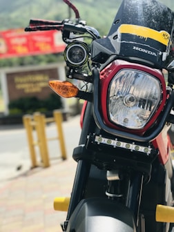 Close-up of hands signing a credit agreement with a motorcycle in the background.