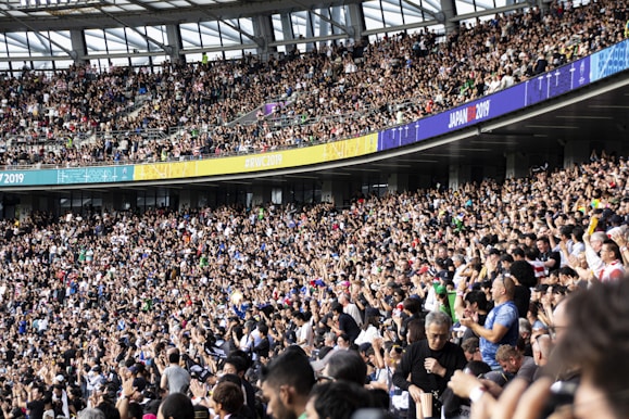 people at the bleachers of the stadium