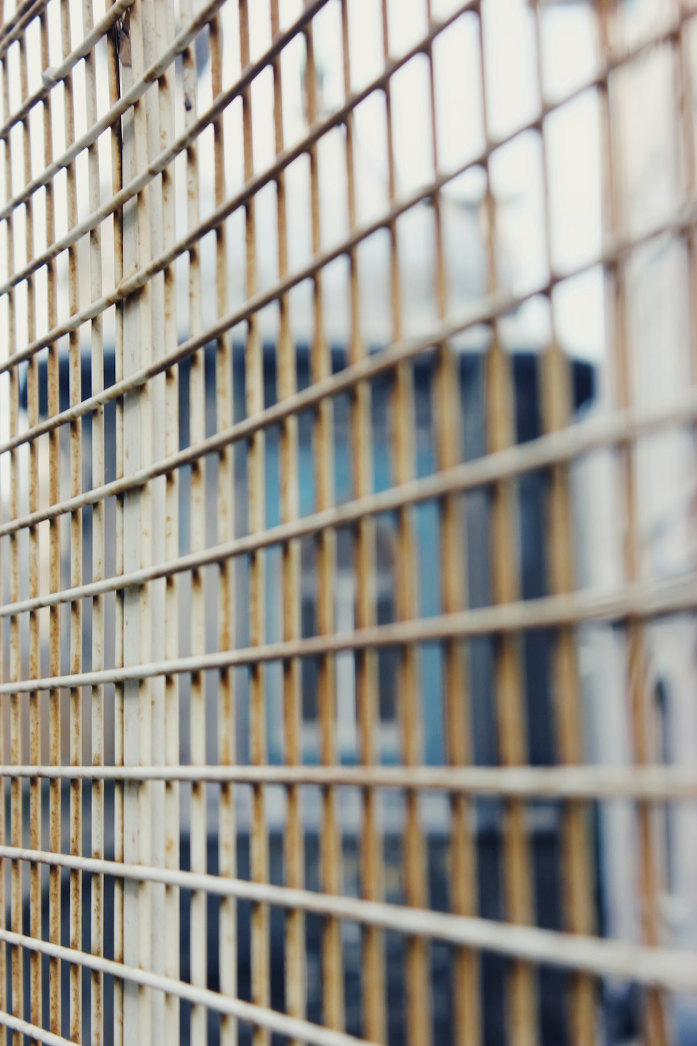 white and brown metal fence