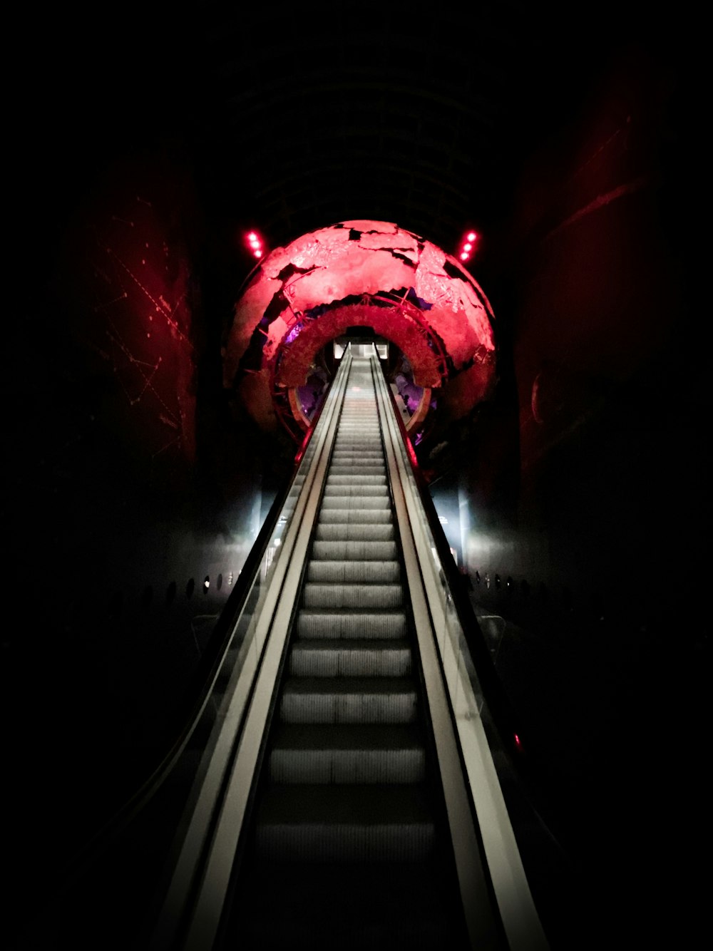 empty elevator with red and white lights