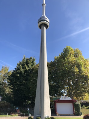 A well-maintained monopole tower surrounded by green landscape.