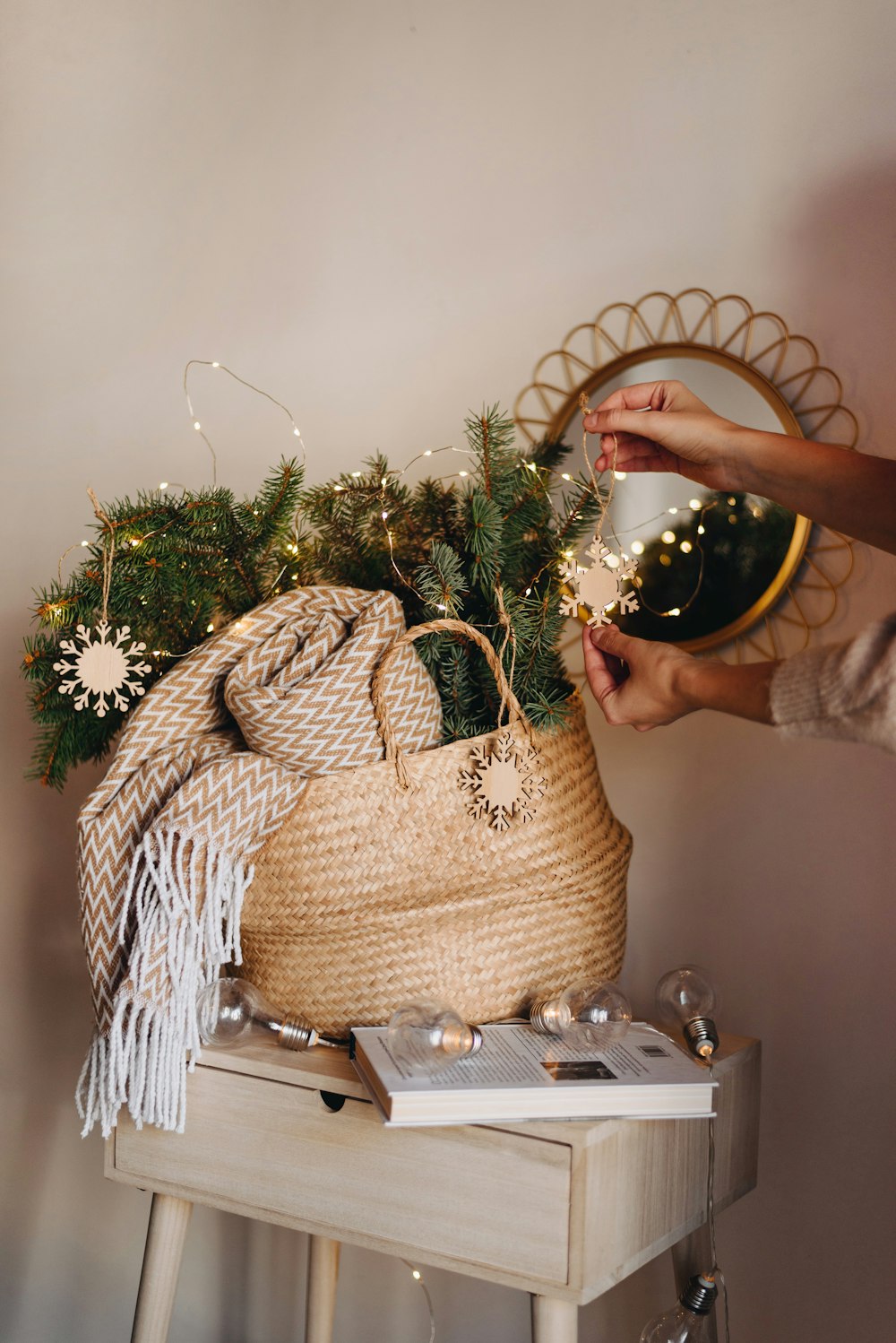 fringe scarf and green plants in brown woven basket