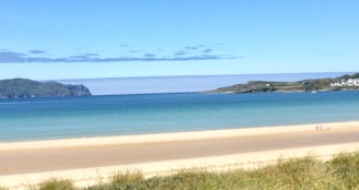 A serene beach scene with a traveler looking at the horizon, symbolizing adventure and safety.