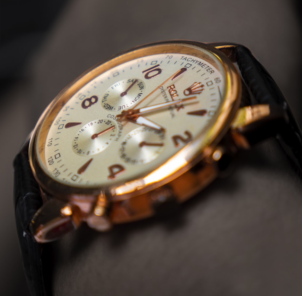 a close up of a watch on a person's wrist