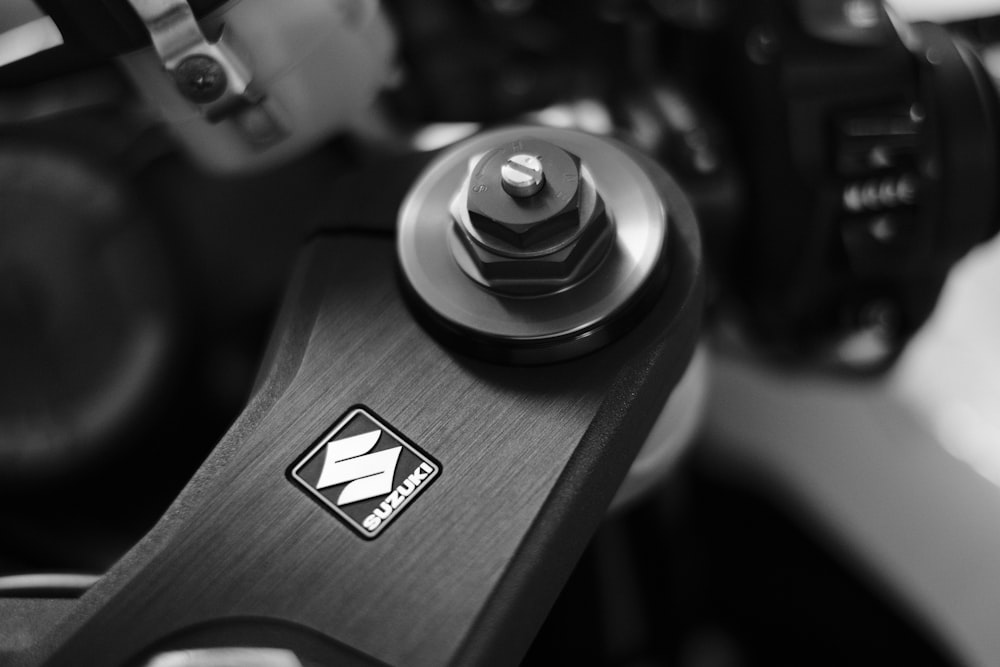 grayscale photography of Suzuki motorcycle handlebar