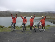Bikers celebrating after completing a race, full of joy.