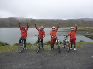 A group of diverse cyclists celebrating after a successful race.